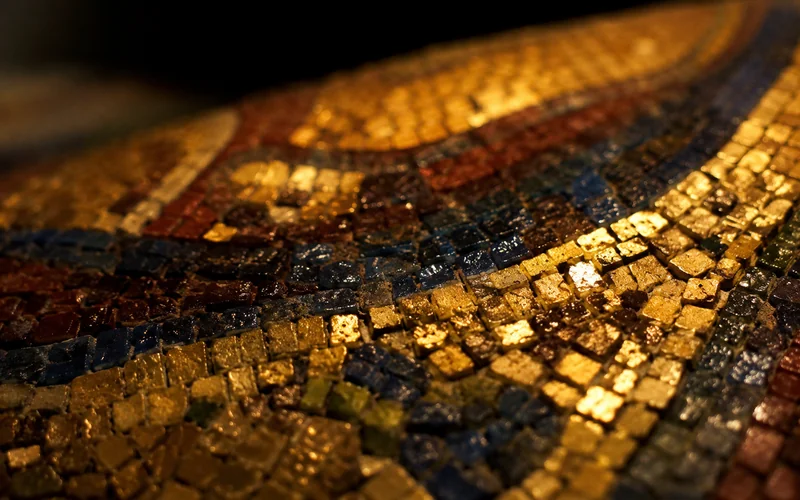 Gold and blue glass mosaic tesserae — illustrative