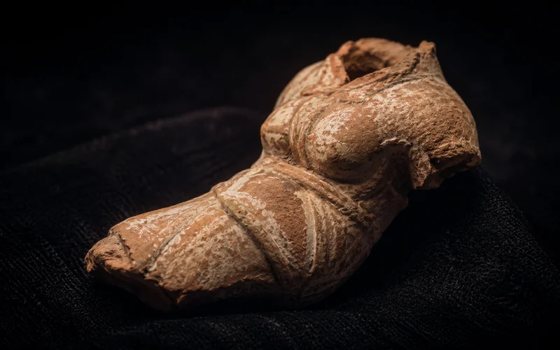 Fragmentary terracotta figurine torso — illustrative